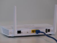 white router on white table ps5 hdmi cable tv connection