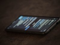 a close up of a cell phone on a table discord app, ban notification, blocked access