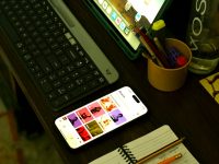 7 Grammar Tools That Improve Writing Accuracy, Clarity, And Style Consistency A desk with a laptop, keyboard, phone and a cup of pencils smartphone video editing app interface, timeline editor, vertical video editing screen, content creator workspace