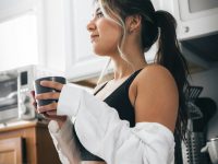 a woman in a kitchen morning routine, healthy habits, casual home setup