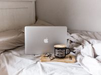 Can You Upload Instagram Stories from a Mac? Here’s How macbook air on brown wooden table morning routine, healthy habits, casual home setup