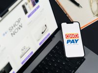 How to Fix Patreon Cannot Add Item to Shop Error A cell phone sitting on top of a laptop computer online payment setup screen, bank account connection, digital payout settings