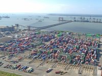 4 Port Logistics Optimization Platforms With Automated Load and Route Planning Aerial view of a busy shipping port with many containers. container port aerial view, cargo ships, shipping containers, logistics hub