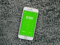 white samsung android smartphone on gray textile budget app interface, monthly expense categories, smartphone budgeting screen