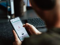 a person holding a phone person thinking with smartphone, dating app profile paused, account deactivated screen